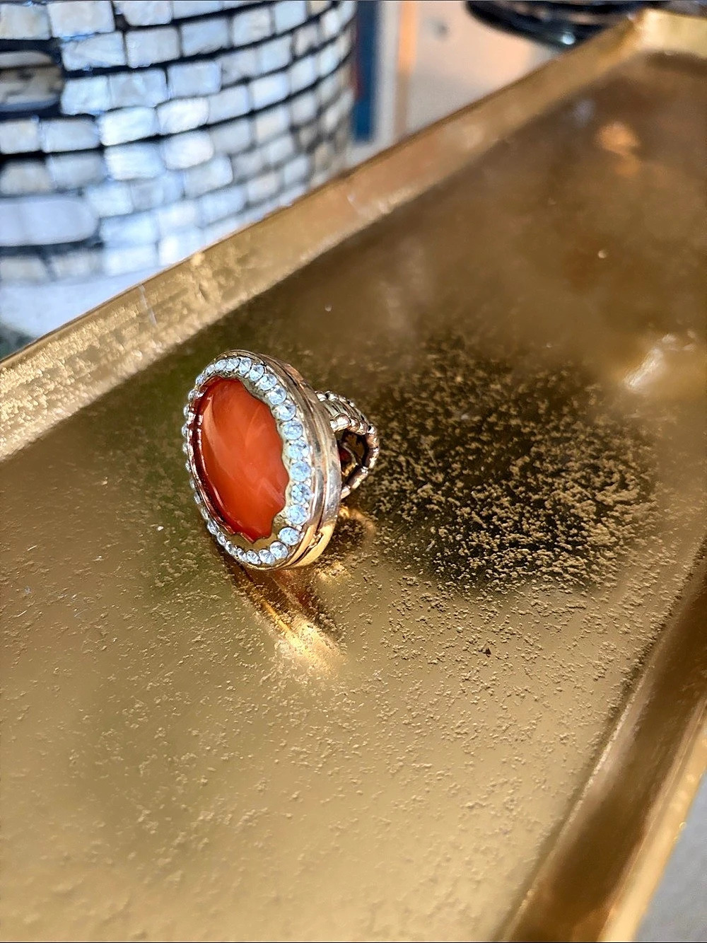 Oval Orange Stone Cocktail Ring In A Diamond Halo Setting.